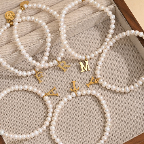 57 Golden Pearl Initial Letter Bracelet